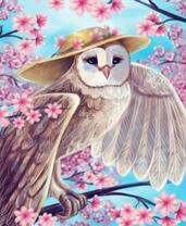 Сова в шляпке на цветущей сакуре